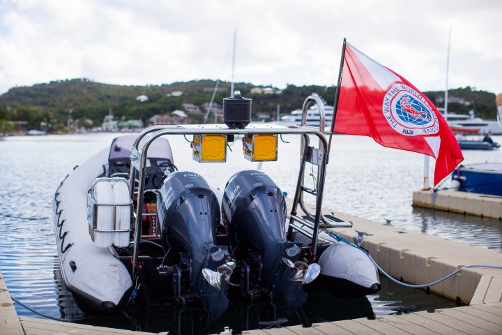 a boat sitting next to a body of water