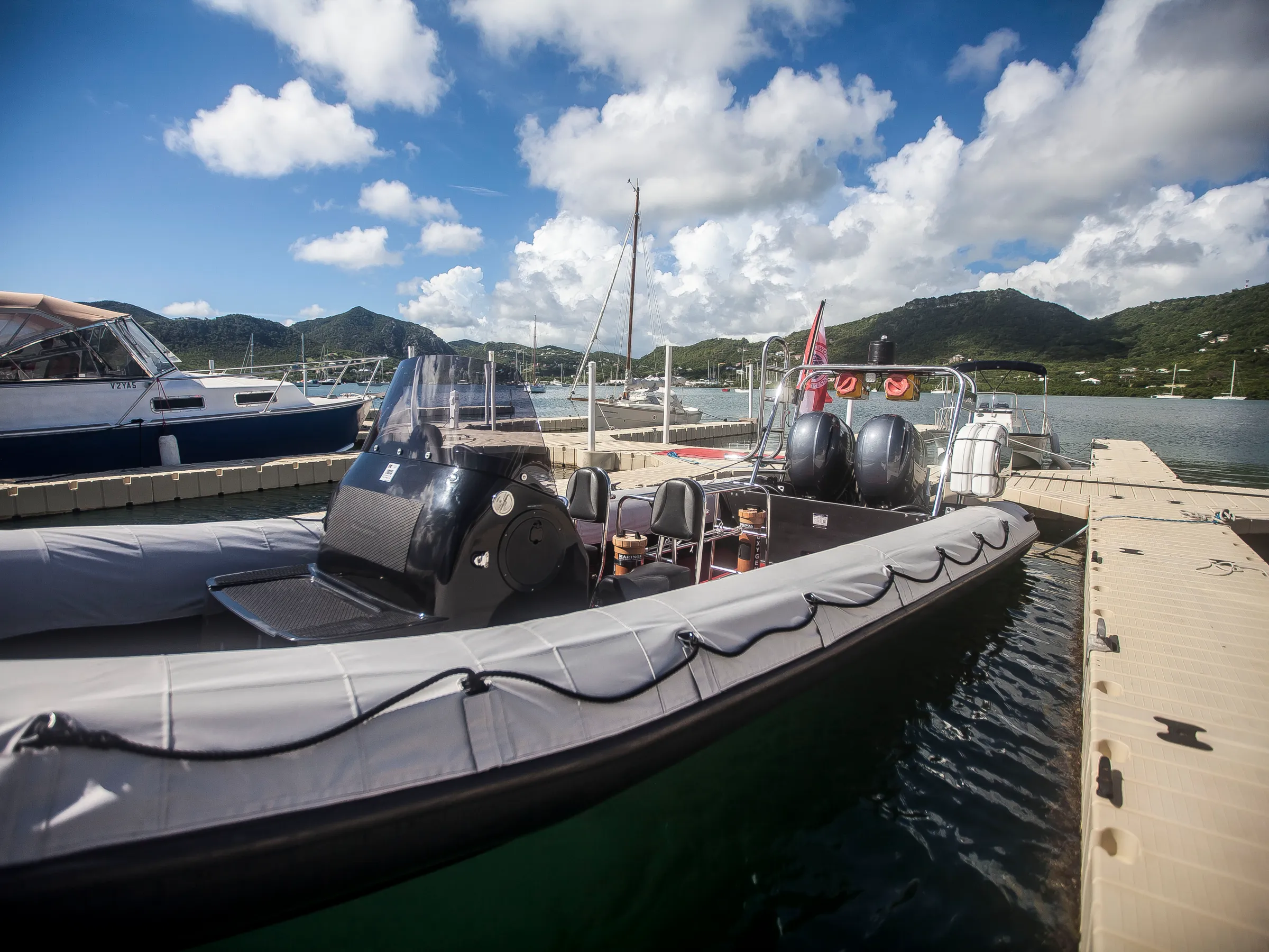 a boat is docked next to a body of water