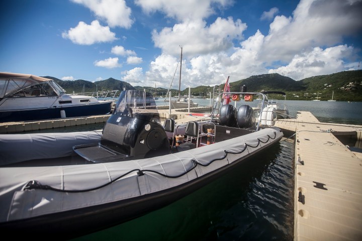 a boat is docked next to a body of water