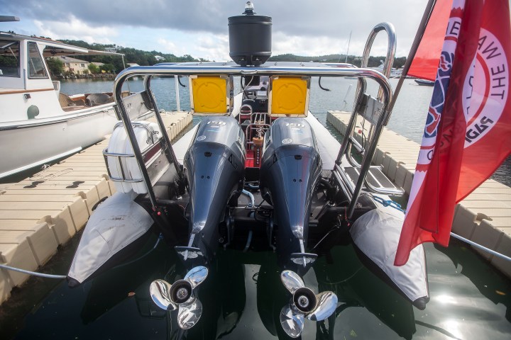 a boat sitting next to a body of water
