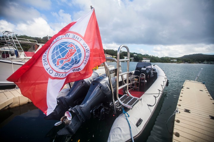 a boat parked next to a body of water