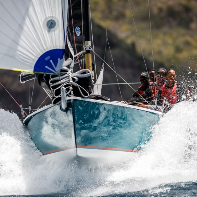 a man riding a wave on a surfboard in the water