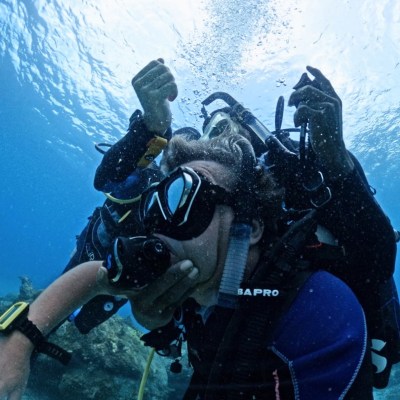 scuba divers practicing rescue techniques