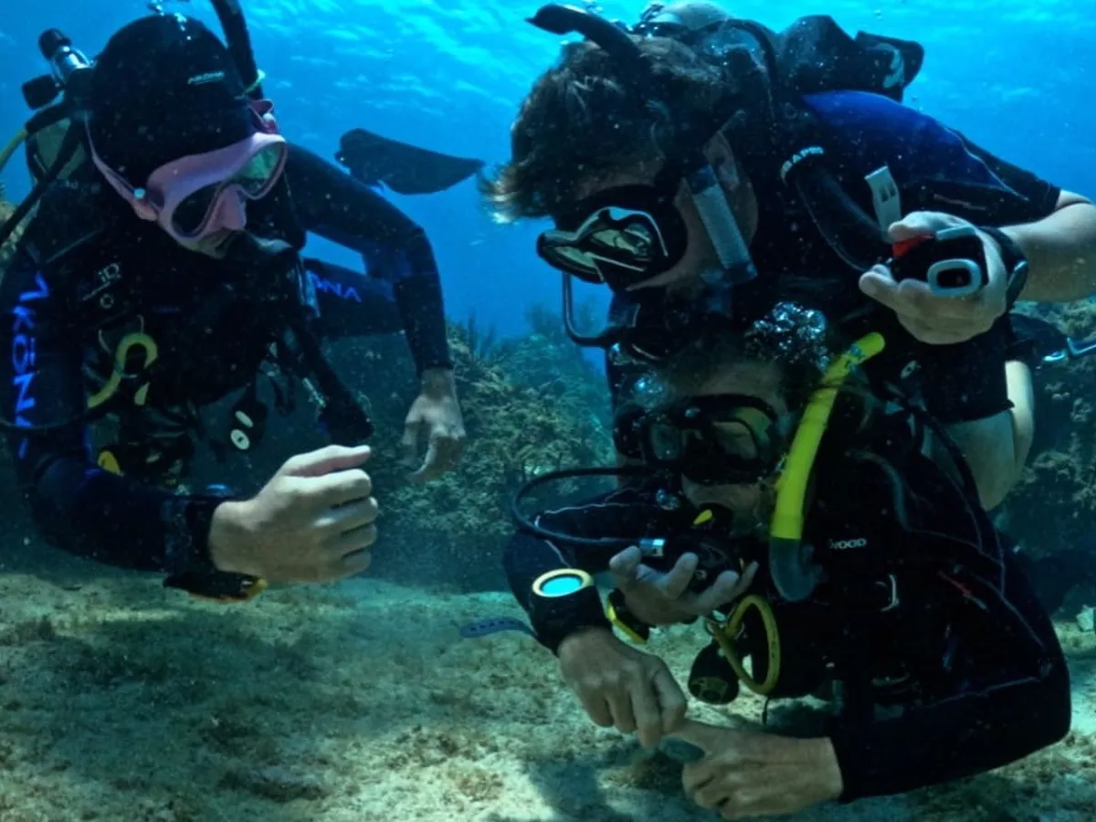 scuba divers practicing rescue techniques