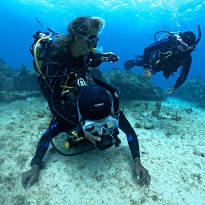 scuba divers practicing rescue techniques