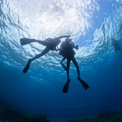 scuba divers practicing rescue techniques